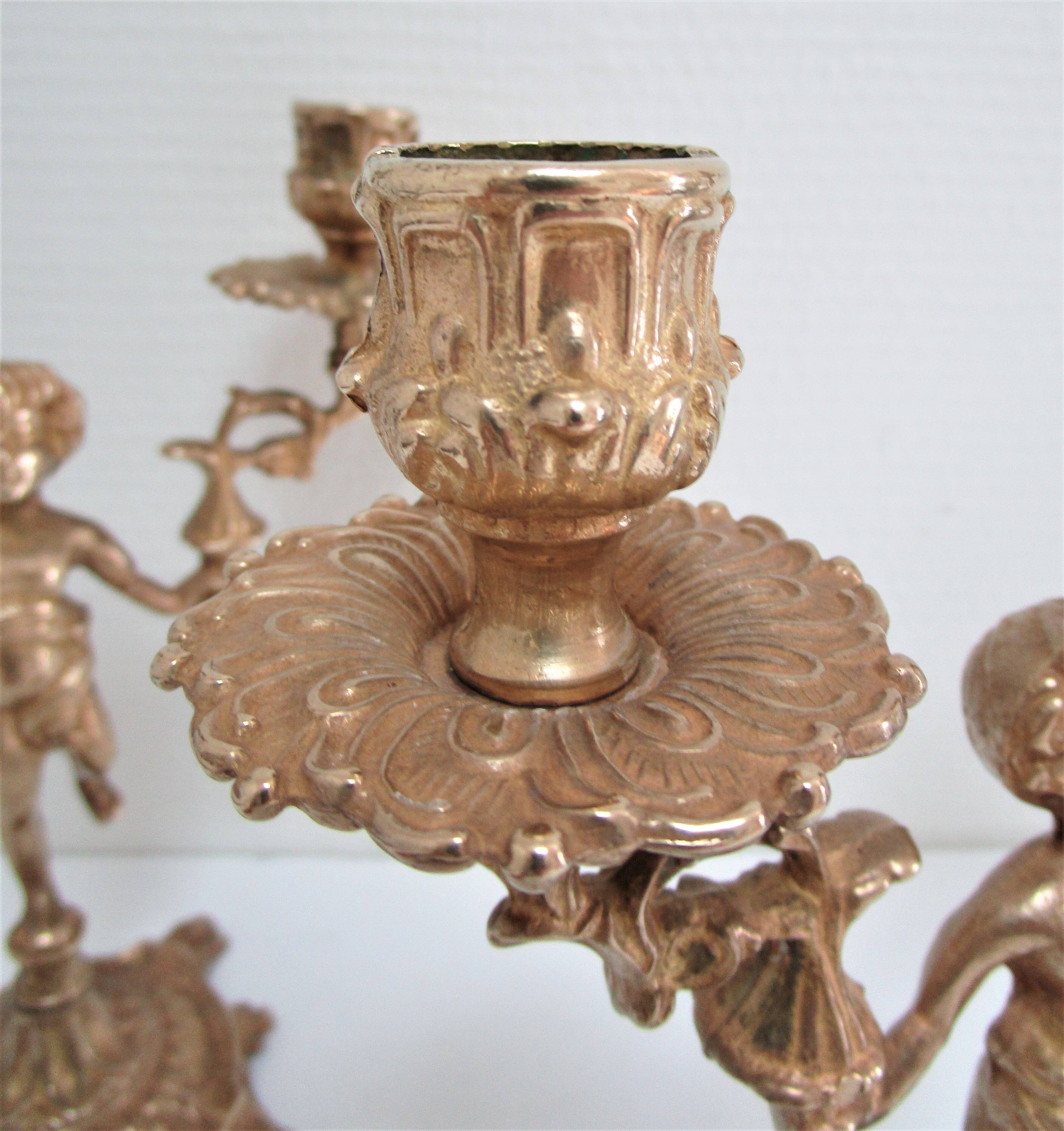 Pair of vintage golden brass cherub candlesticks