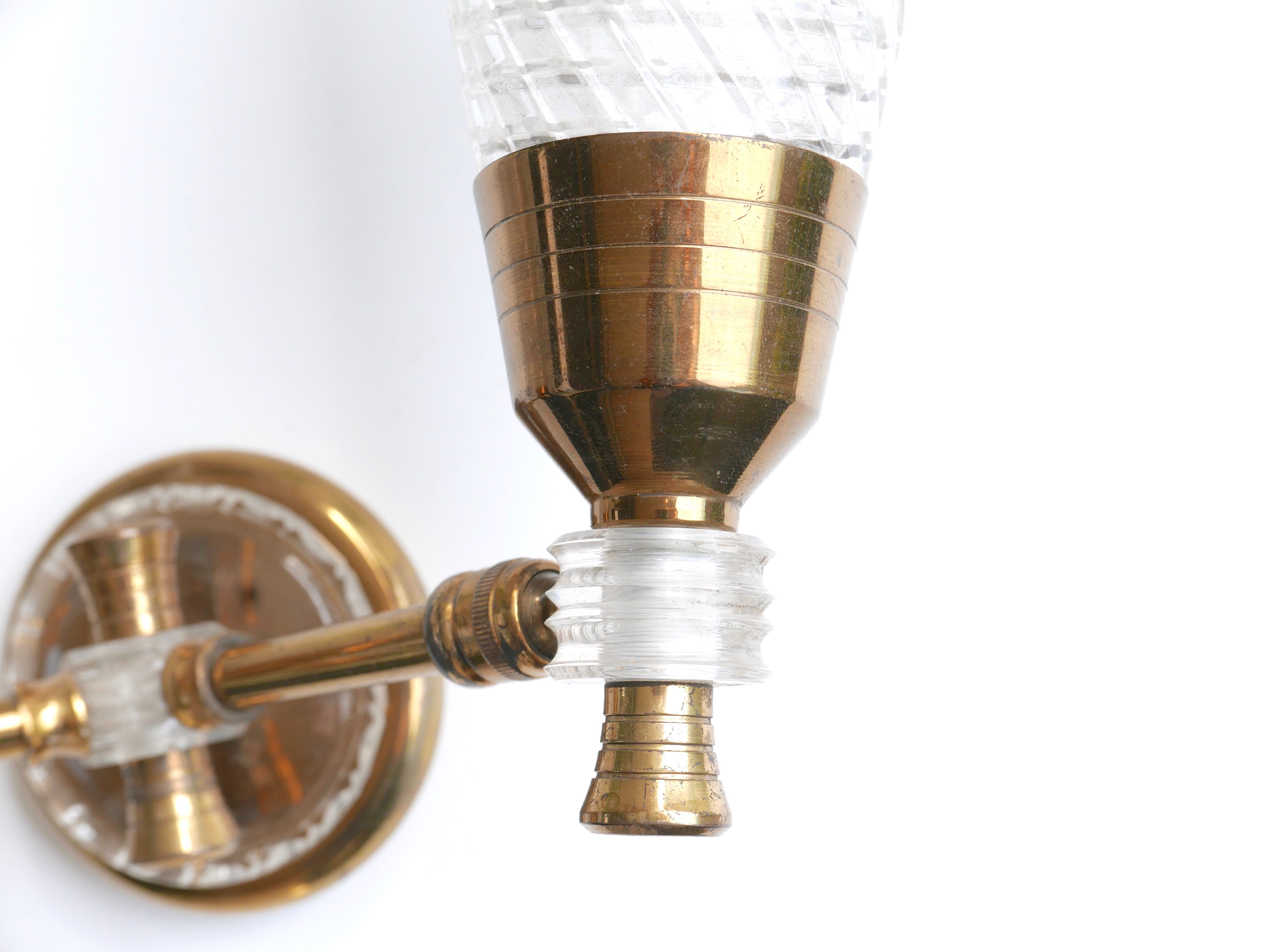 Pair of wall sconces in gold metal and plexiglass, 50 years