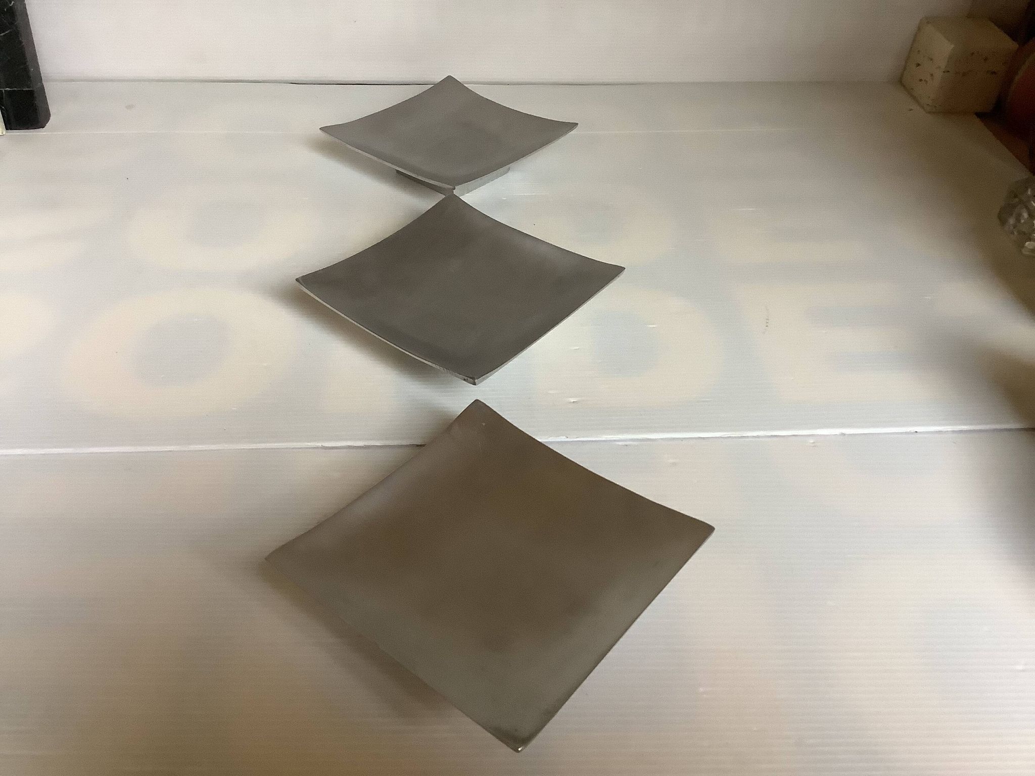 Three silver-plated metal trinket trays/candle holders
