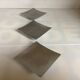 Three silver-plated metal trinket trays/candle holders