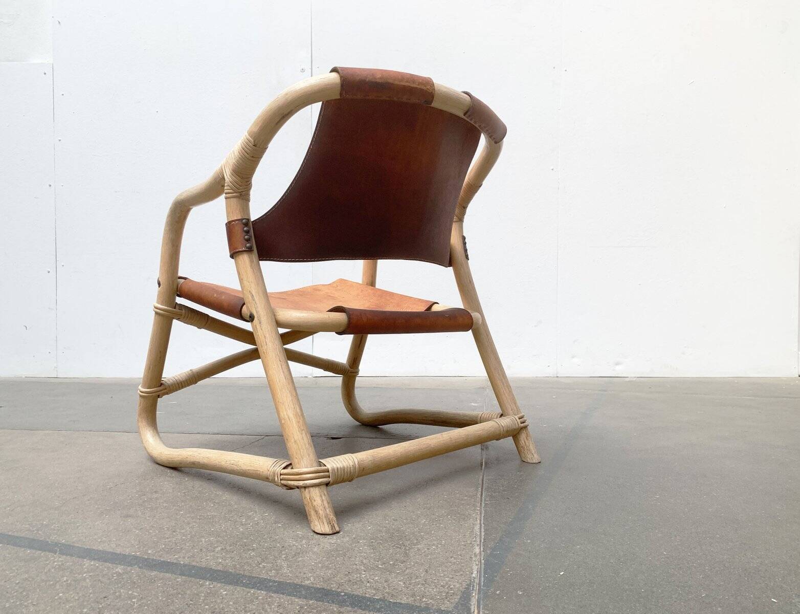 Mid-century safari lounge chair in bamboo and Danish leather, 1960s.