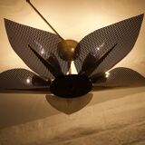 Ceiling light with perforated brass petals.