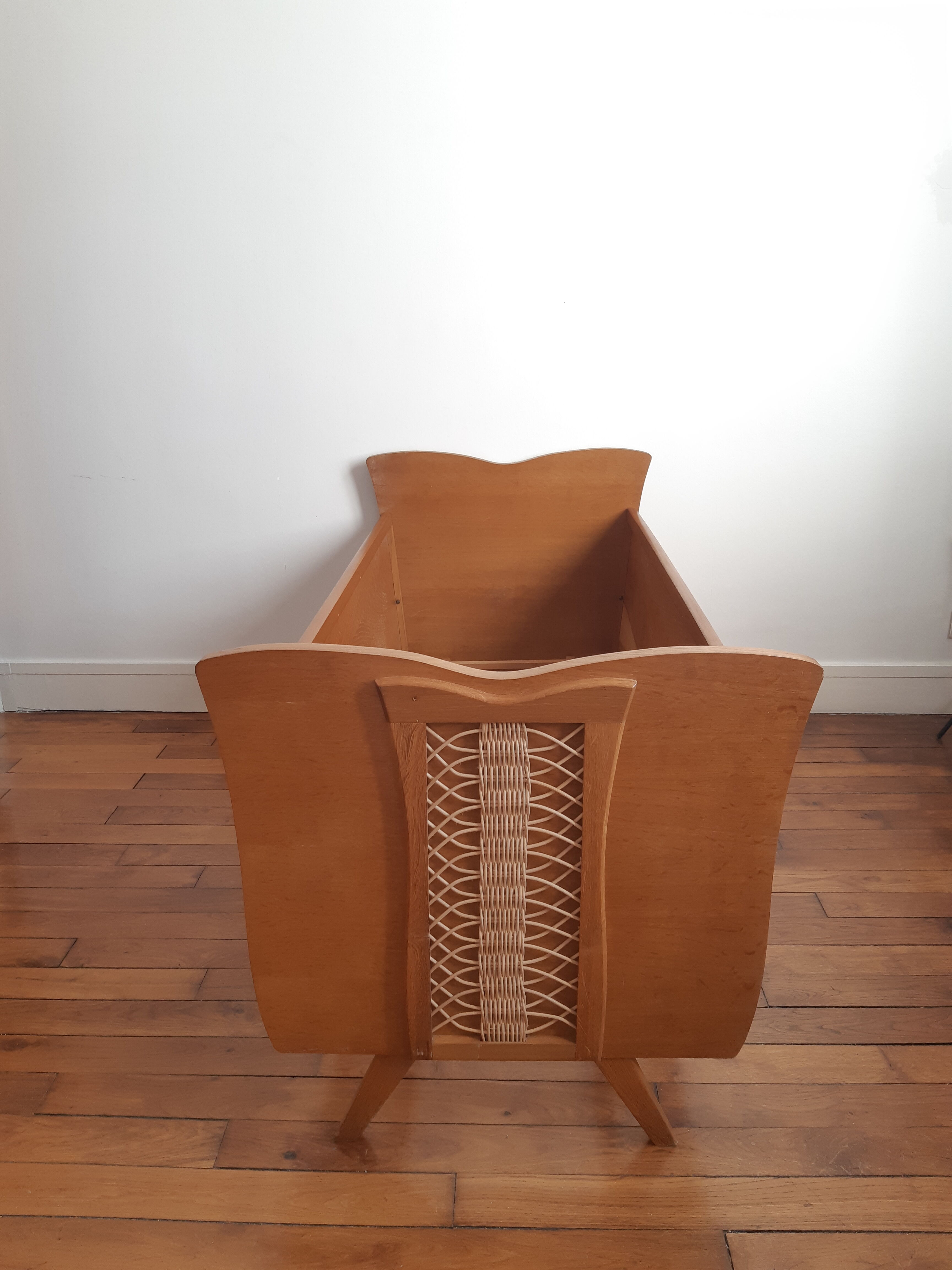 Wooden bed and vintage rattan