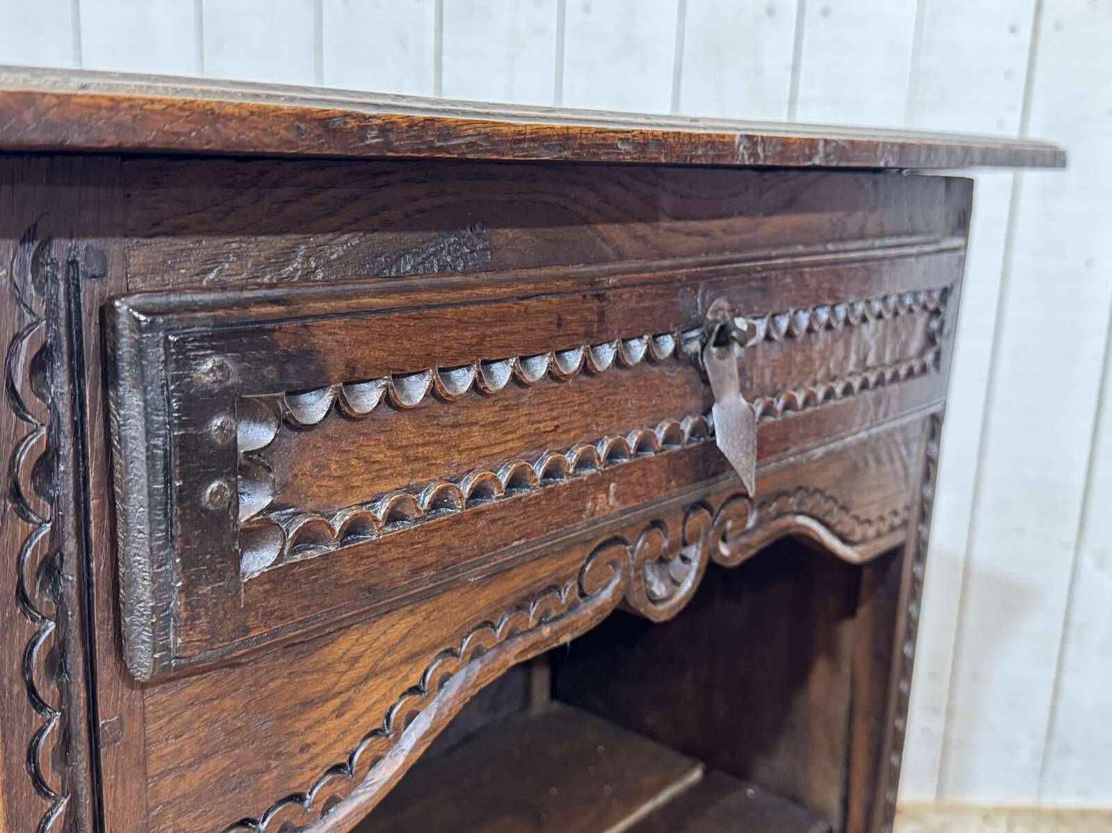 Oak accent furniture bookshelf with a drawer, early 20th century work.