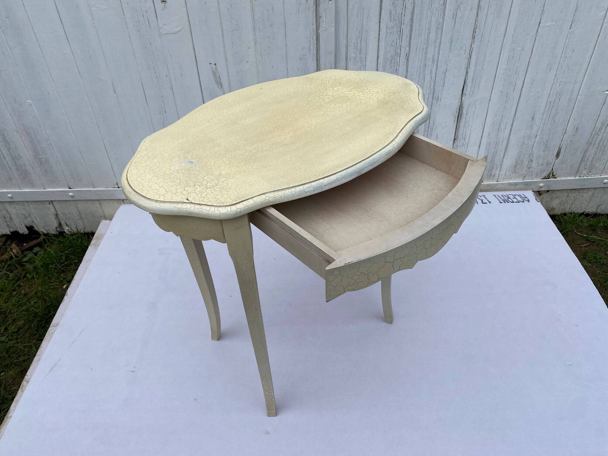 Eggshell-coloured drawer with a cracked effect side table.