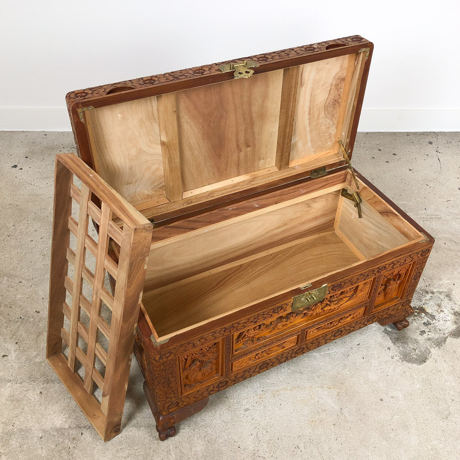 Vintage Chinese carved camphor wood chest on claw feet