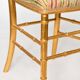 Pair of golden wood chairs in a bamboo style.