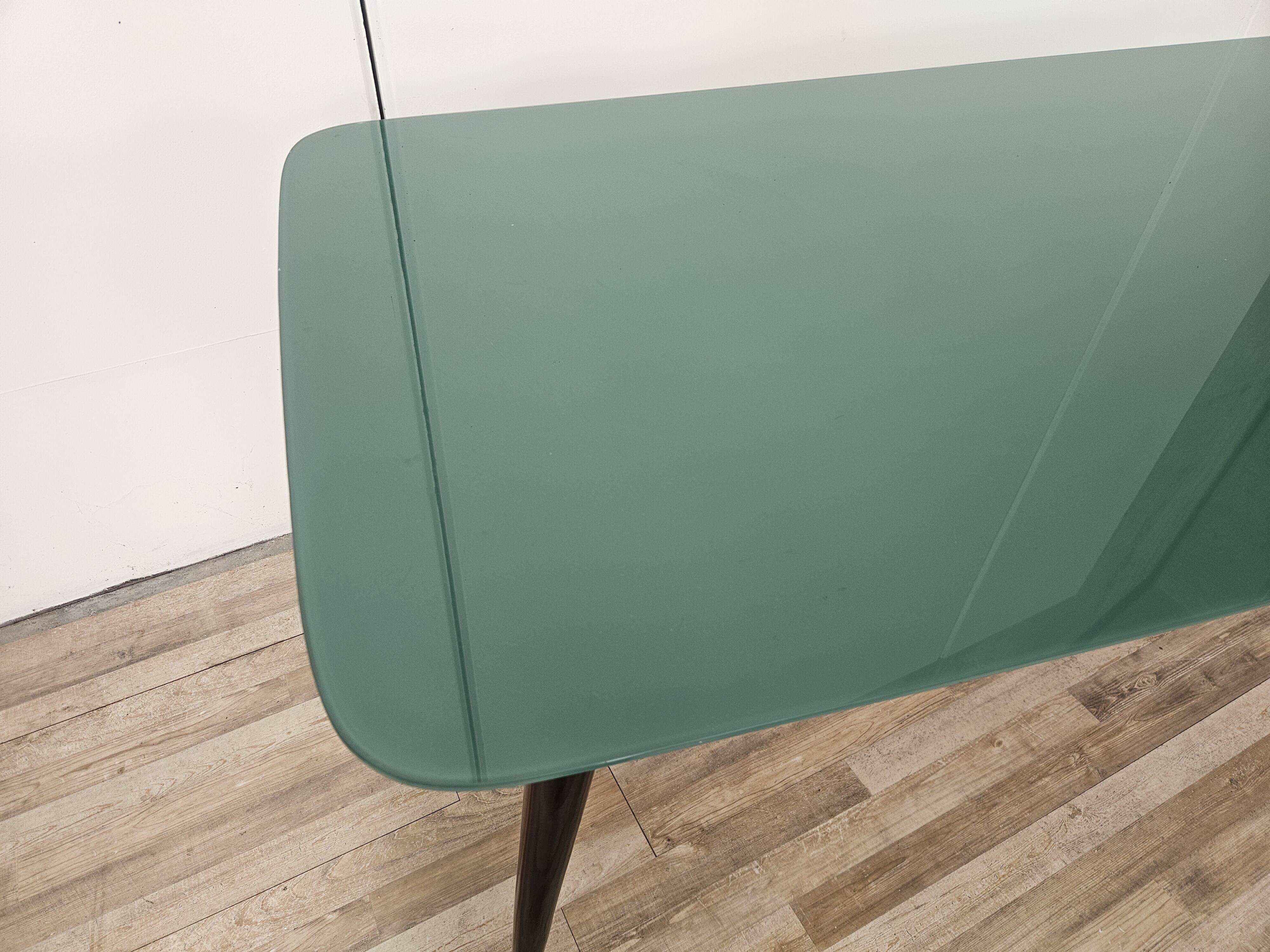 Mid-century mahogany dining table with aquamarine glass top