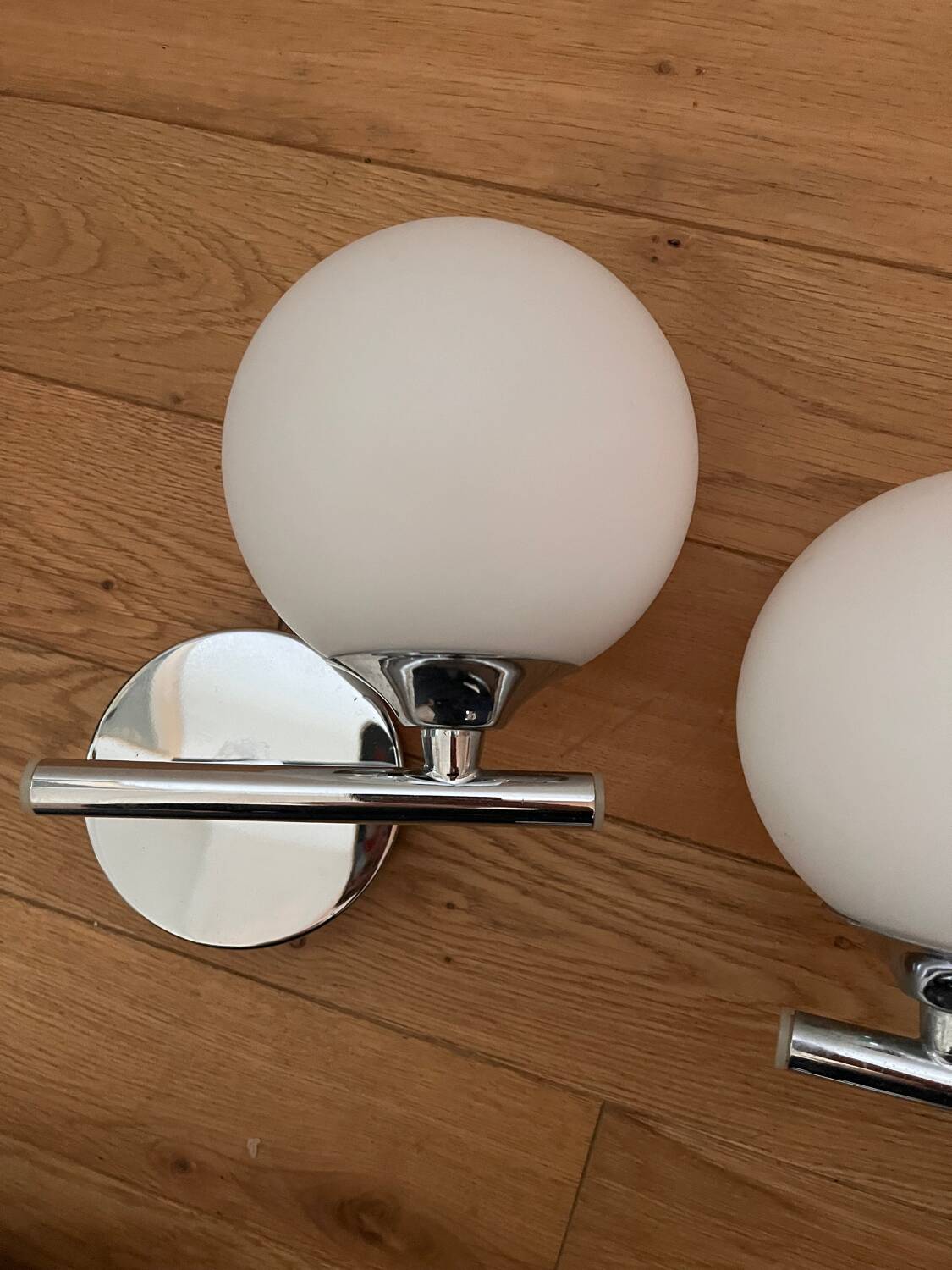 Pair of metal and opaline wall lights
