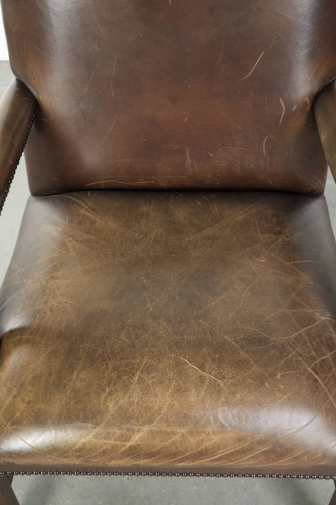 Wooden cow leather English Gainsborough chair with a stunning appearance