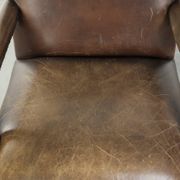 Wooden cow leather English Gainsborough chair with a stunning appearance