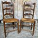 Pair of Rustic Antique Turned Wood Chairs + Woven Straw Seat Wine