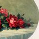 Old oil painting on oval wood with roses thrown from the 30s