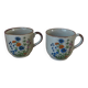 Set of two speckled stoneware mugs with small wildflower bohemian retro design.