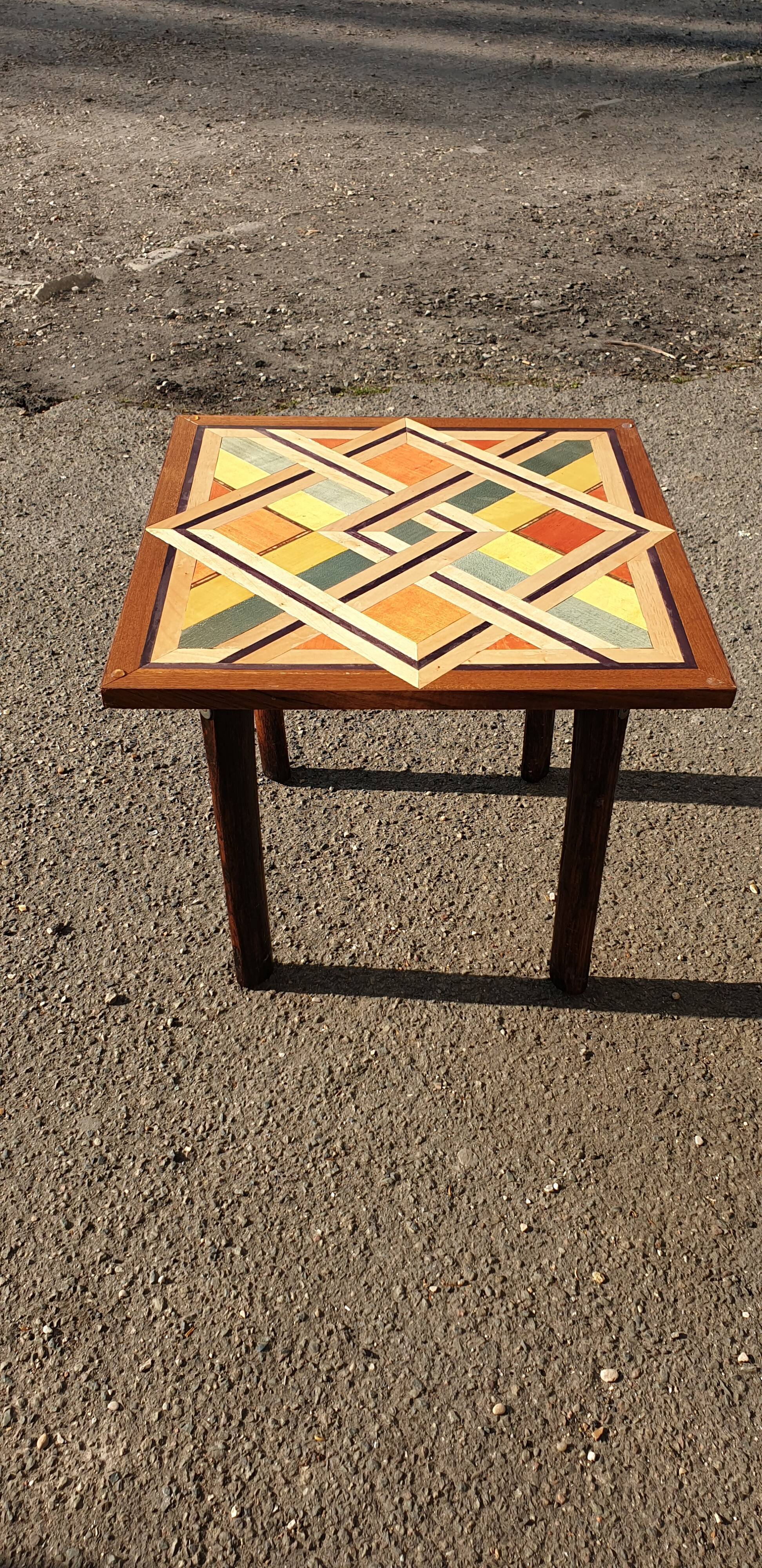 Wooden table with geometric decoration