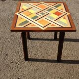 Wooden table with geometric decoration
