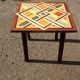 Wooden table with geometric decoration