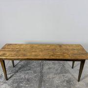 Old farmhouse table with tapered legs, late 19th to early 20th century.