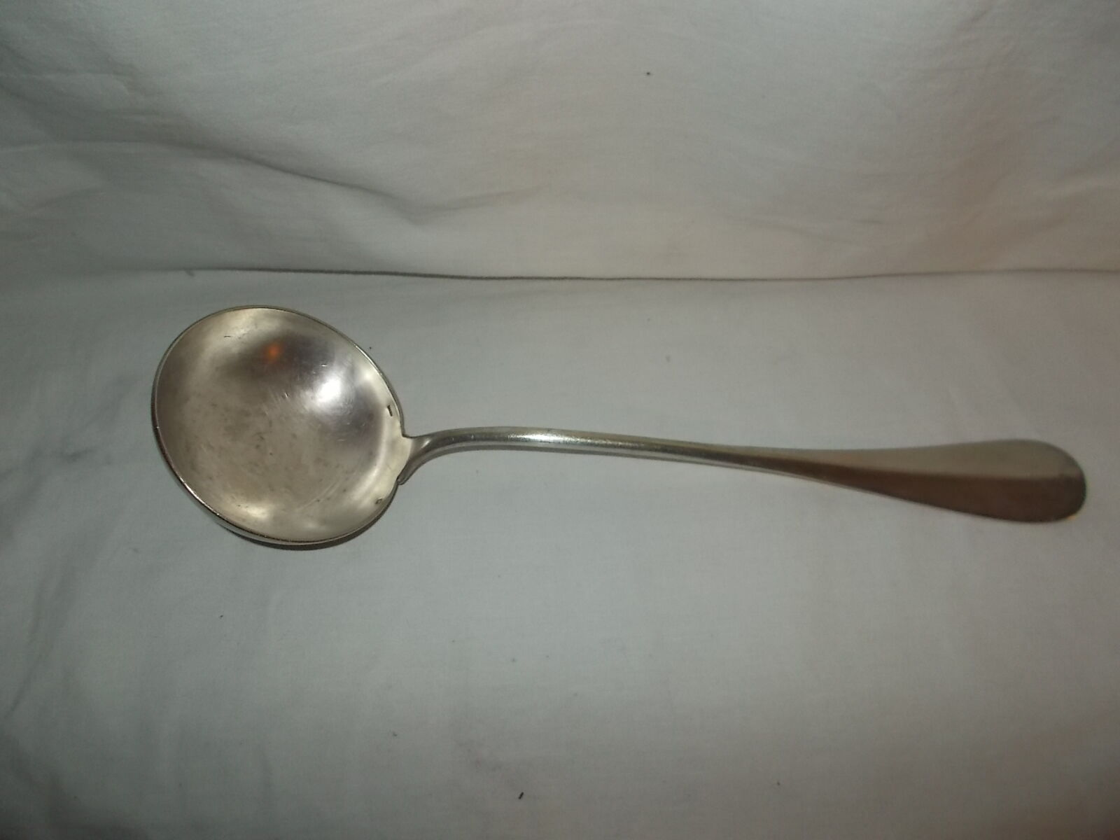 Silver metal ladle