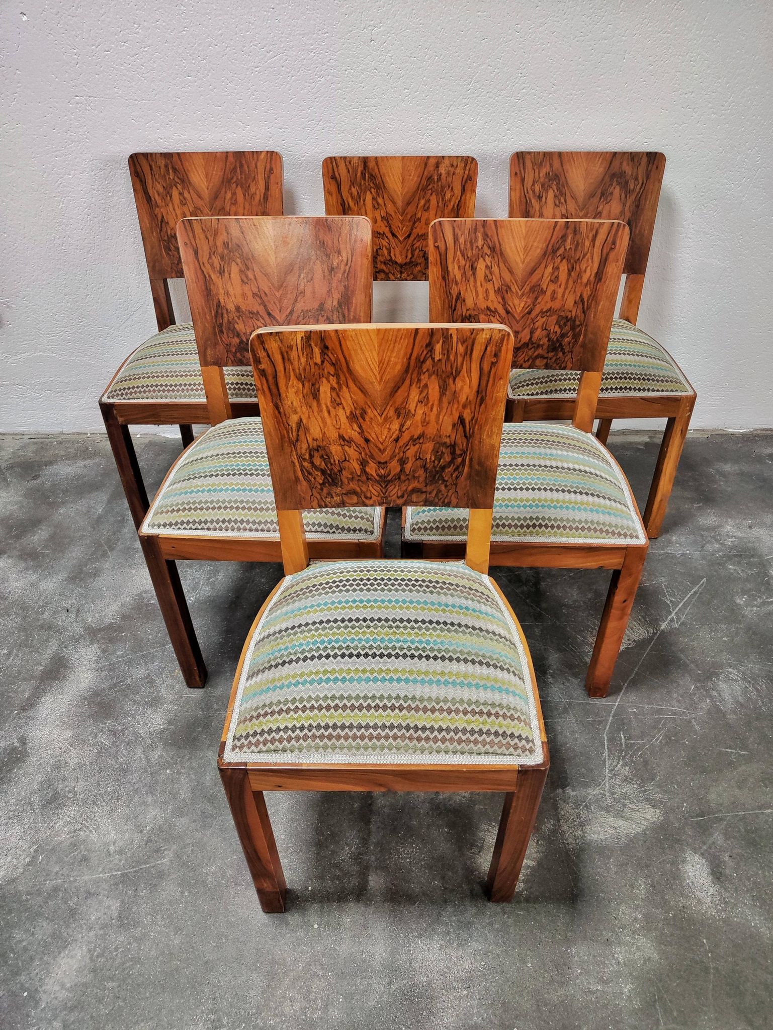Set of six Art Deco dining chairs in walnut root veneer, 1940s.