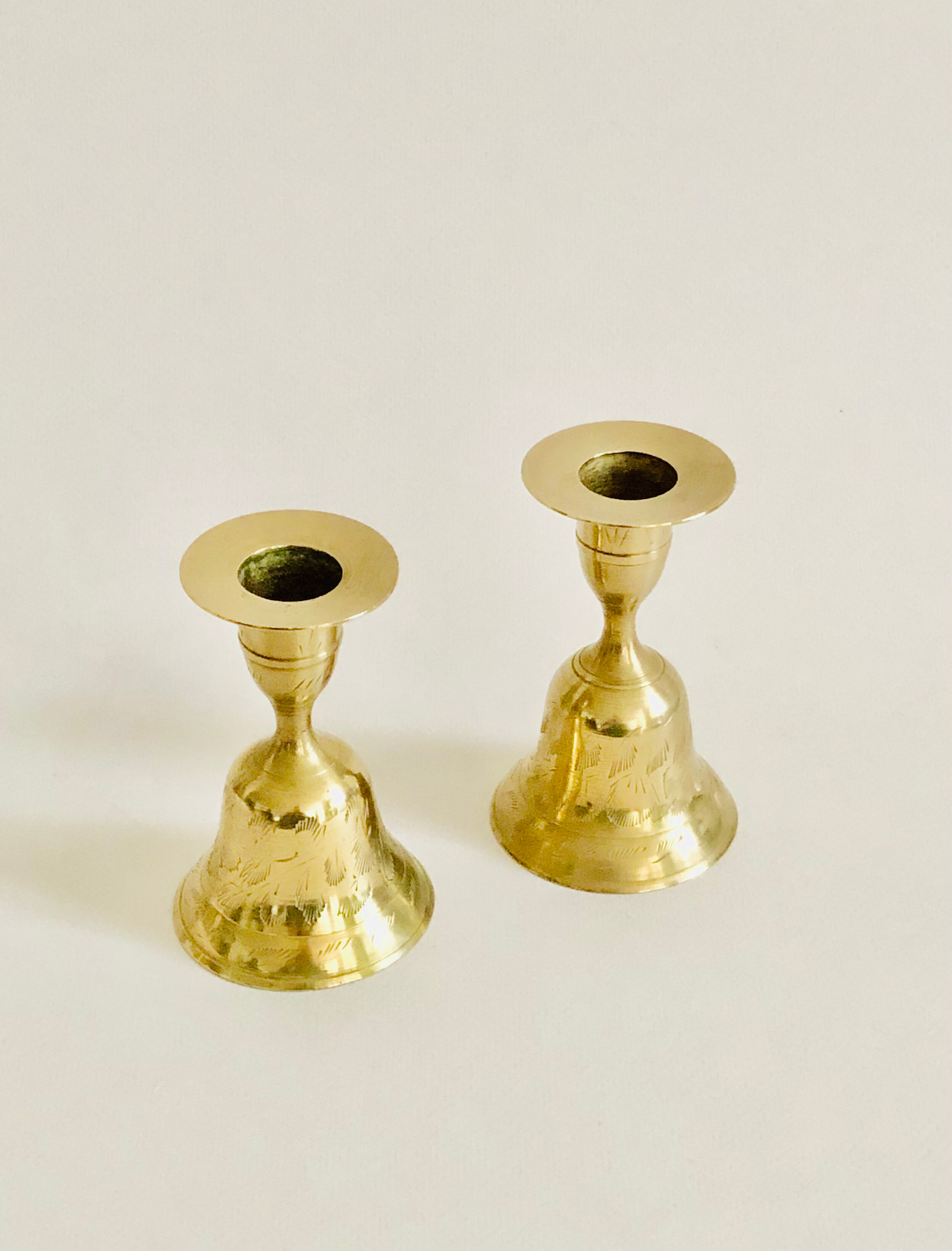 Pair of brass "bell" candle holders
