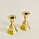 Pair of brass "bell" candle holders