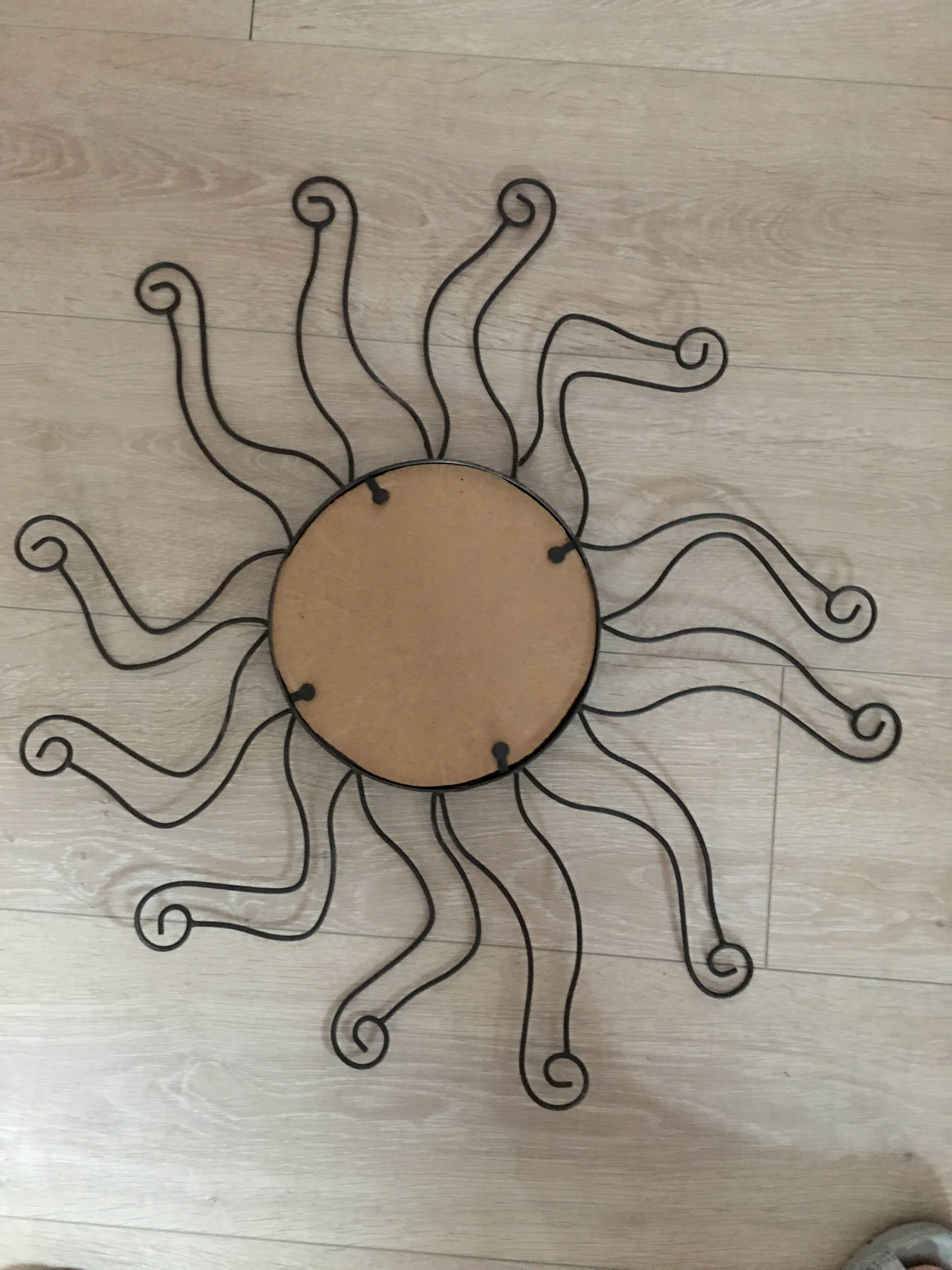 Black metal sun mirror