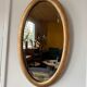 Miroir doré ovale ancien glace biseautée