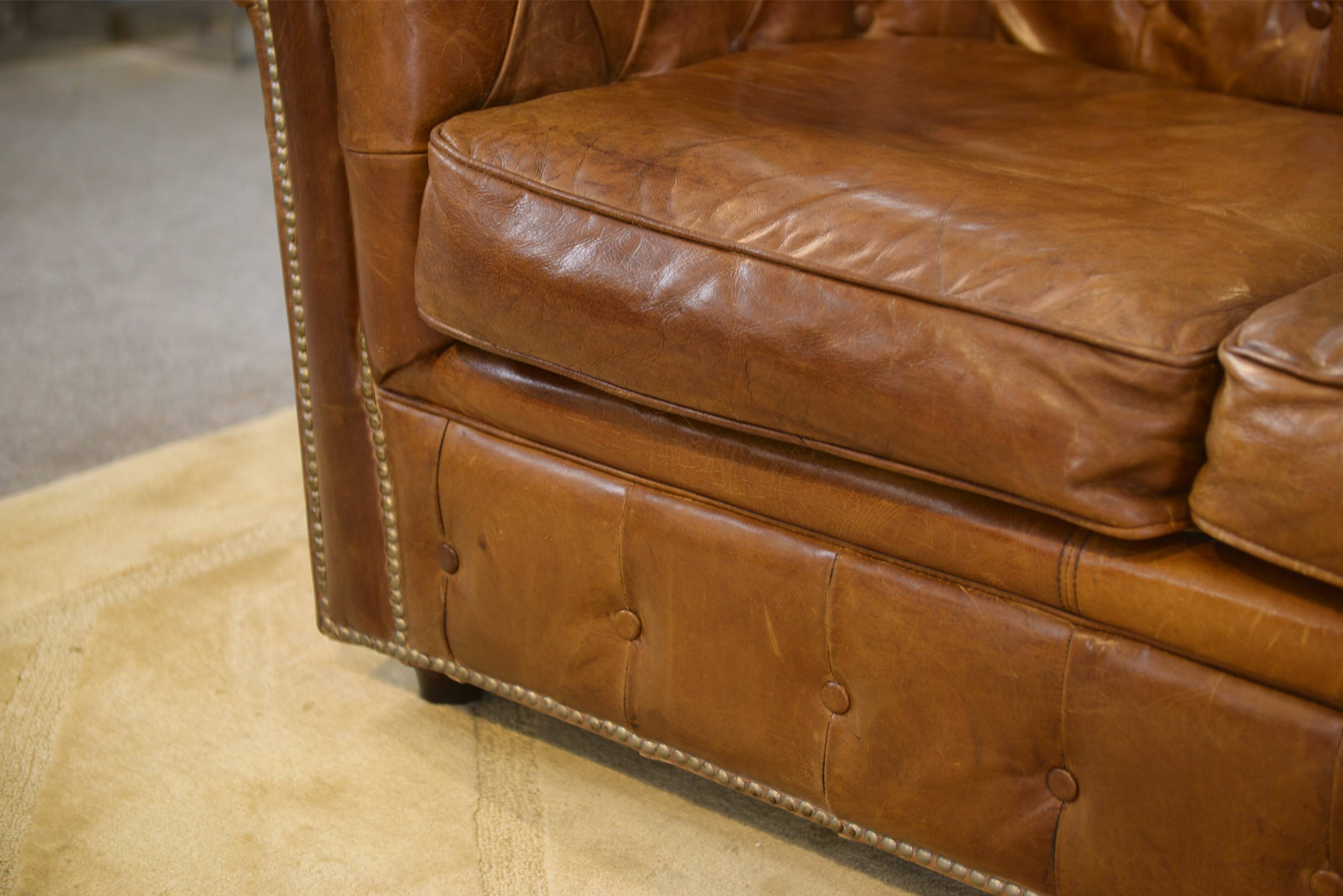 Brown leather Chesterfield sofa