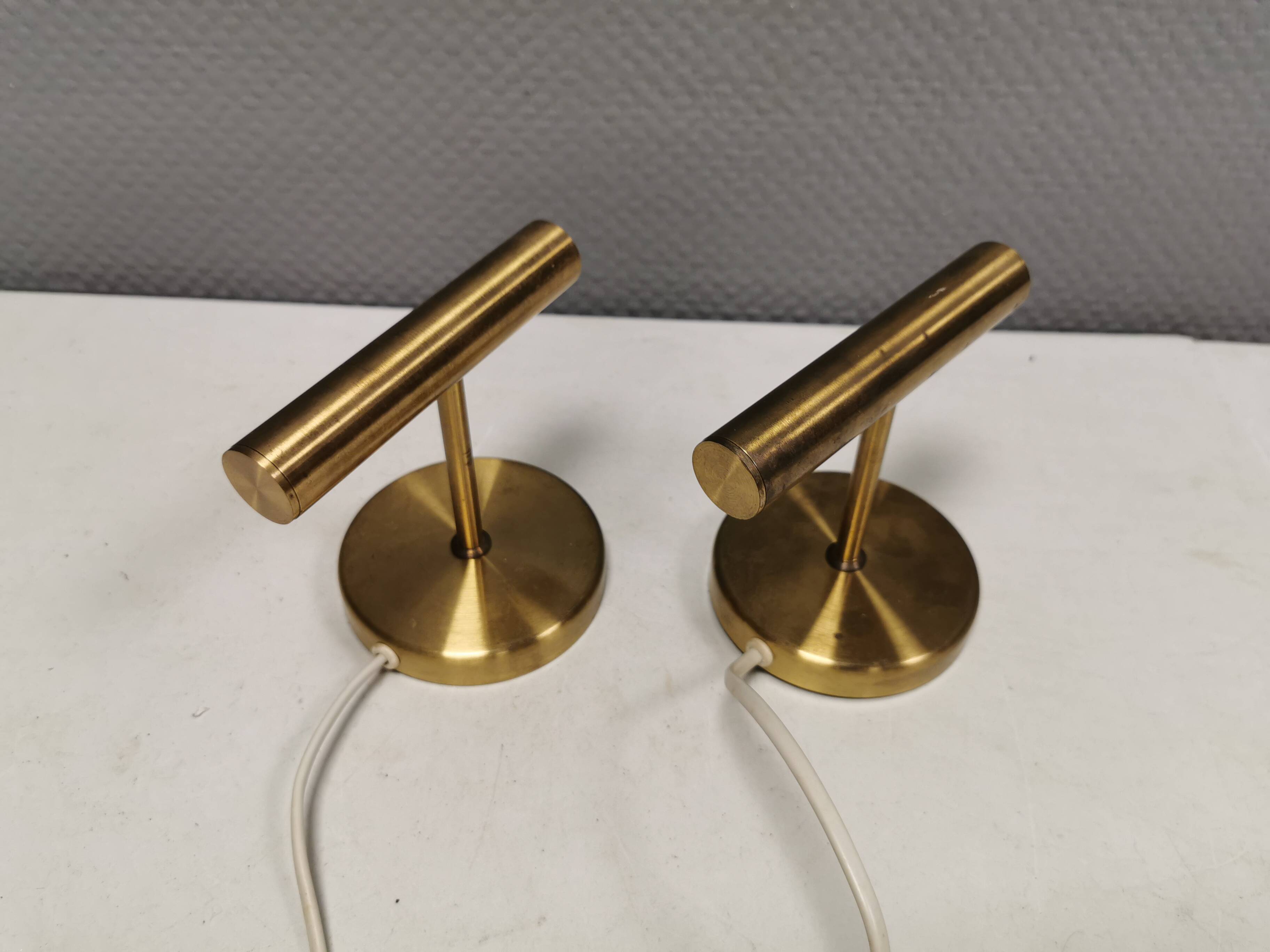 A set of stylish brass wall lamps from Danish Darø