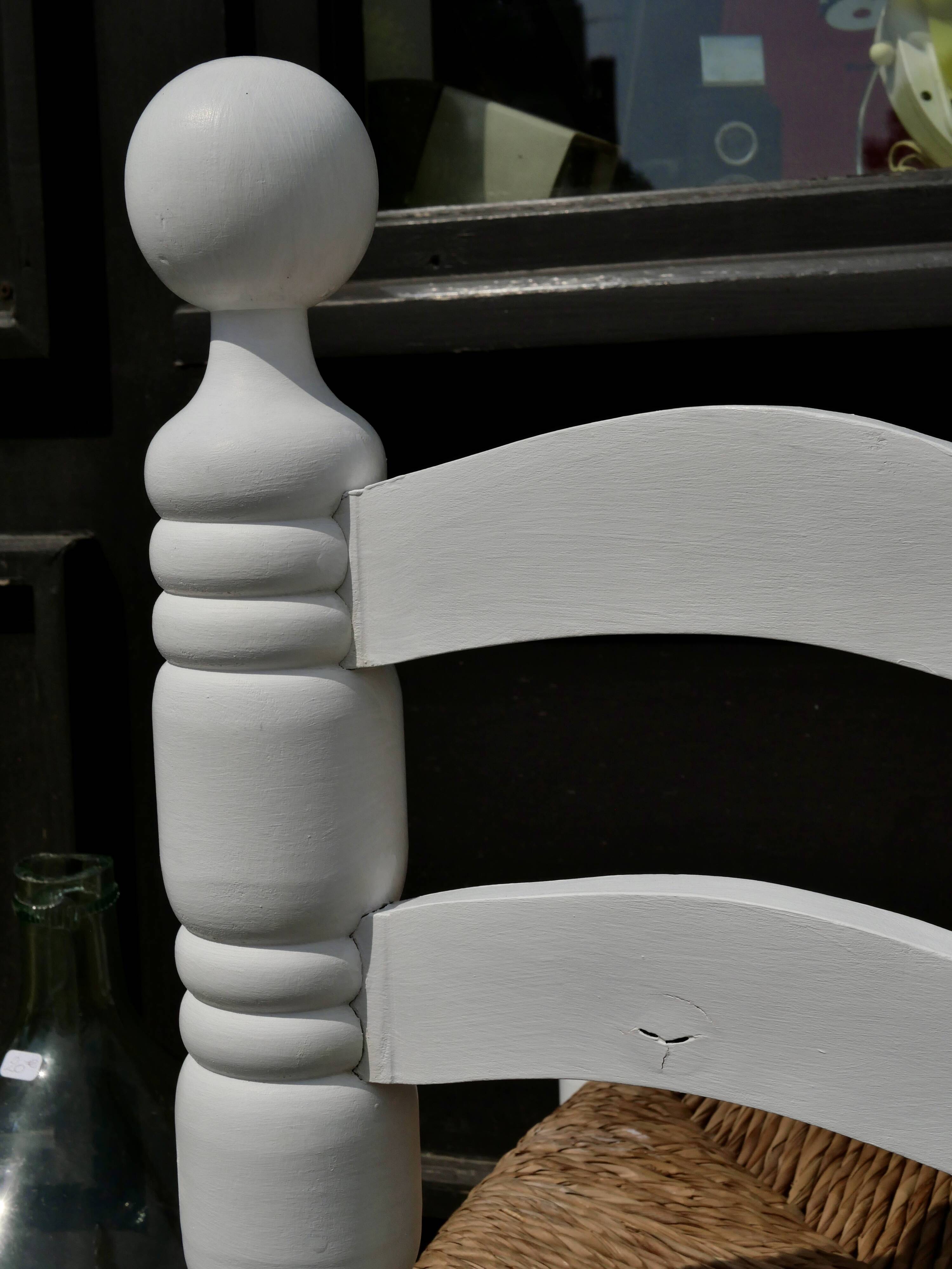 Pair of rush-seated chairs by Charles Dudouyt