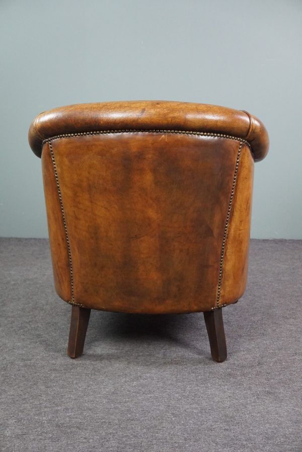 Club chair in patinated sheepskin