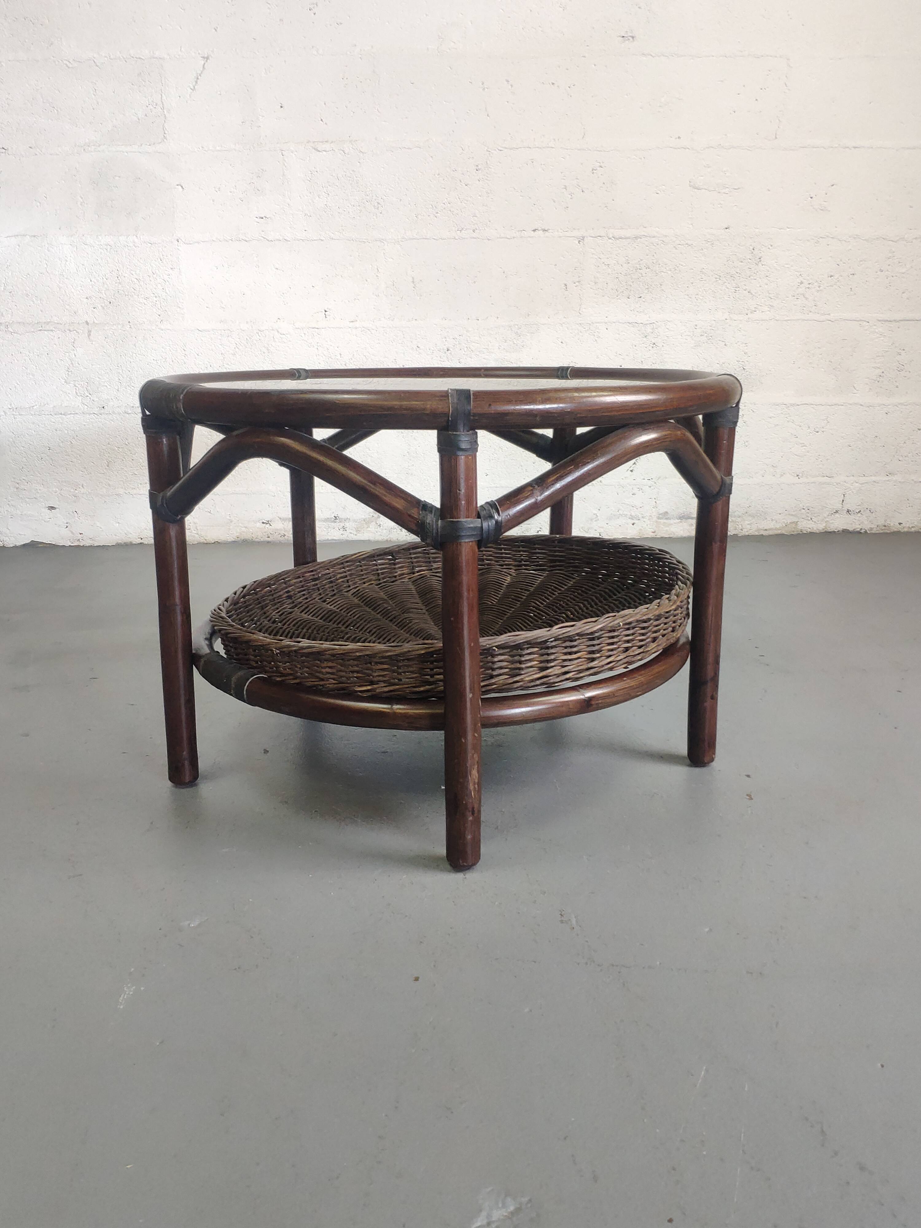 Vintage rattan coffee table with smoked glass top and rattan basket shelf