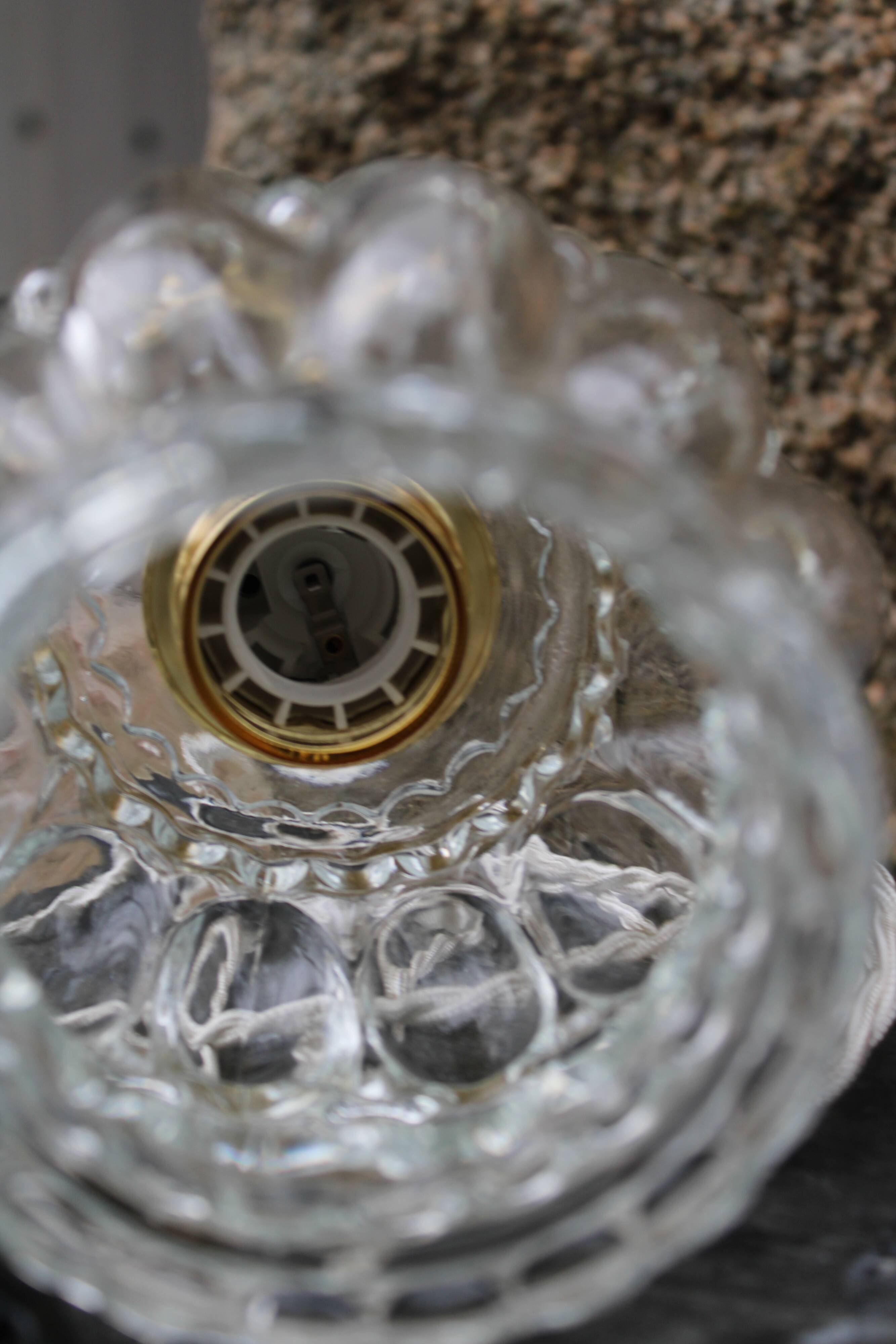 Moulded glass globe hand lamp