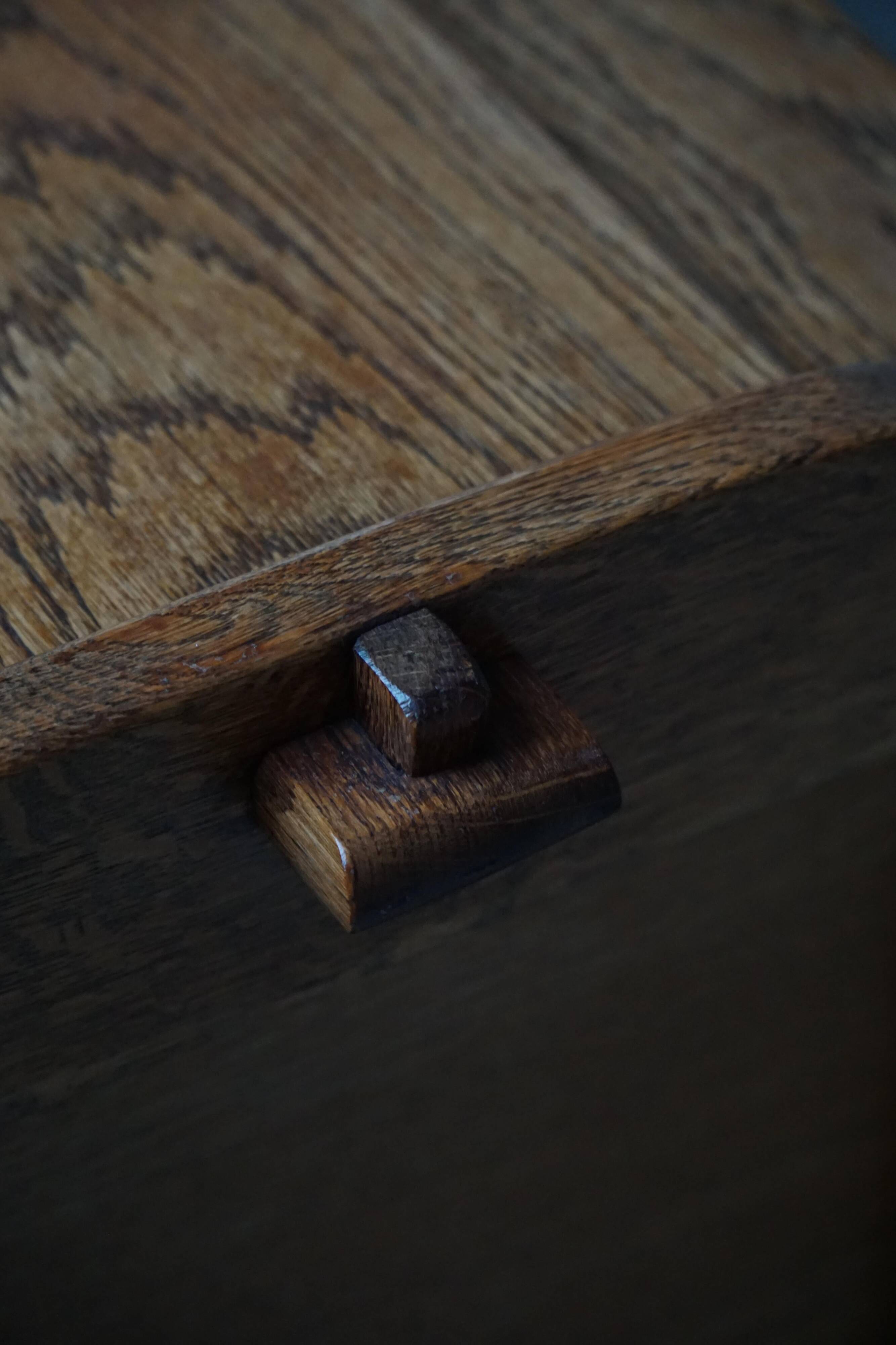 Modern Danish oak commode with decorative relief sculpture, mid-20th century.