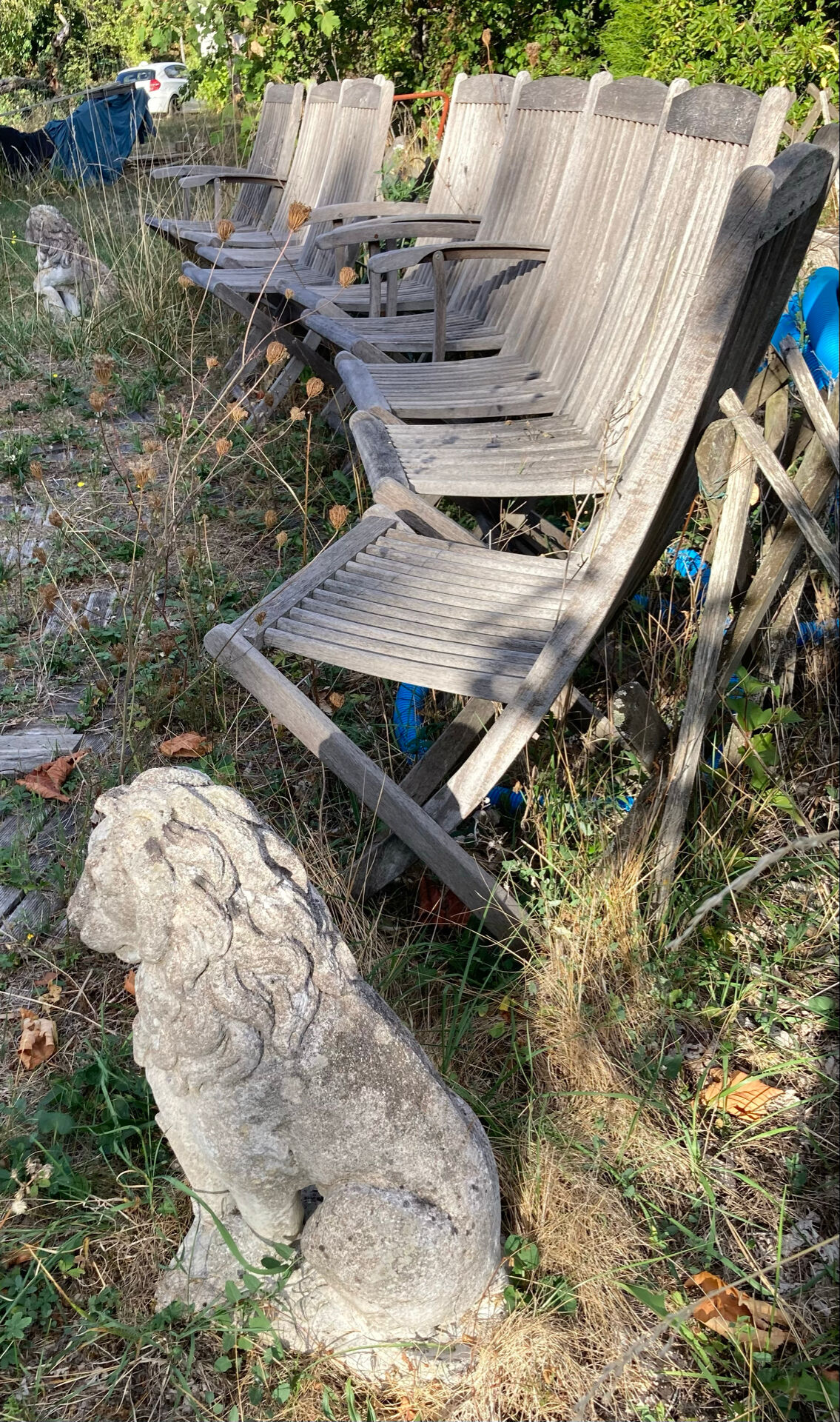 Folding garden chairs and armchairs in River Han dowelled teak.