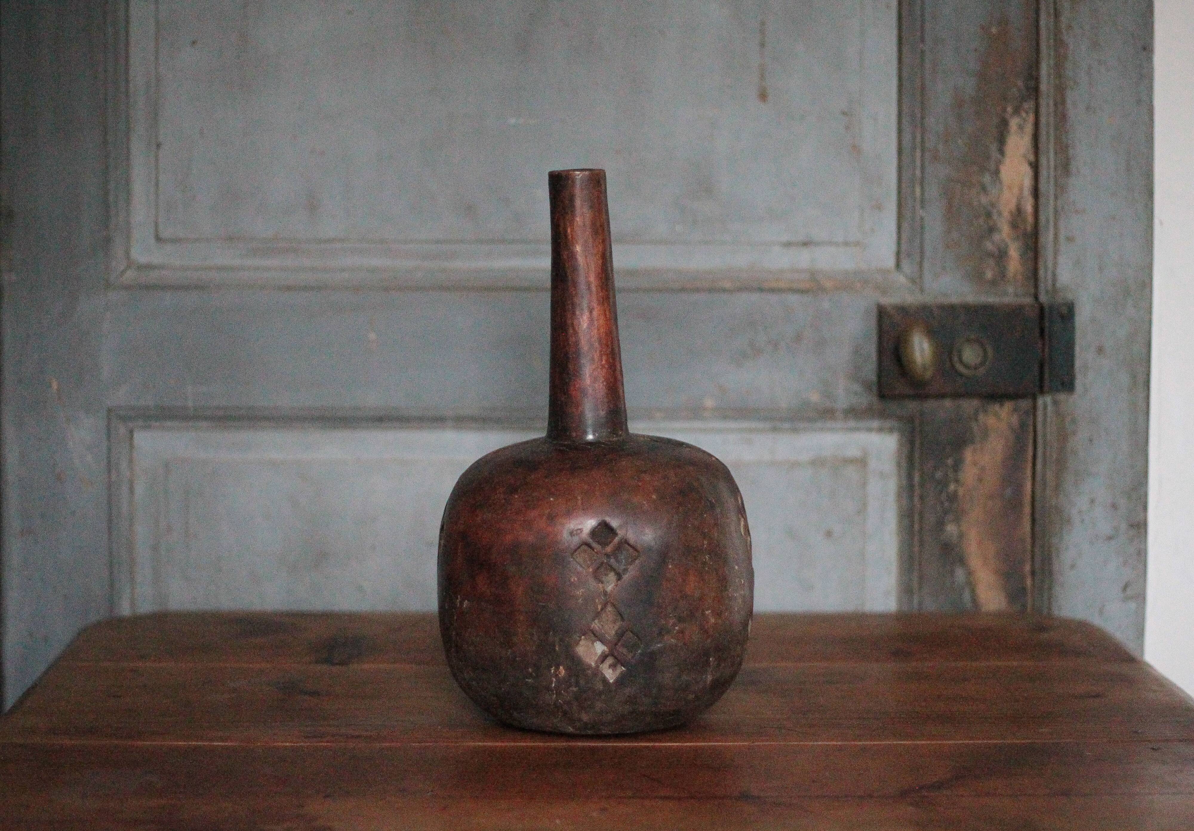 Vintage African wooden carved gourd bottle.