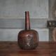 Vintage African wooden carved gourd bottle.