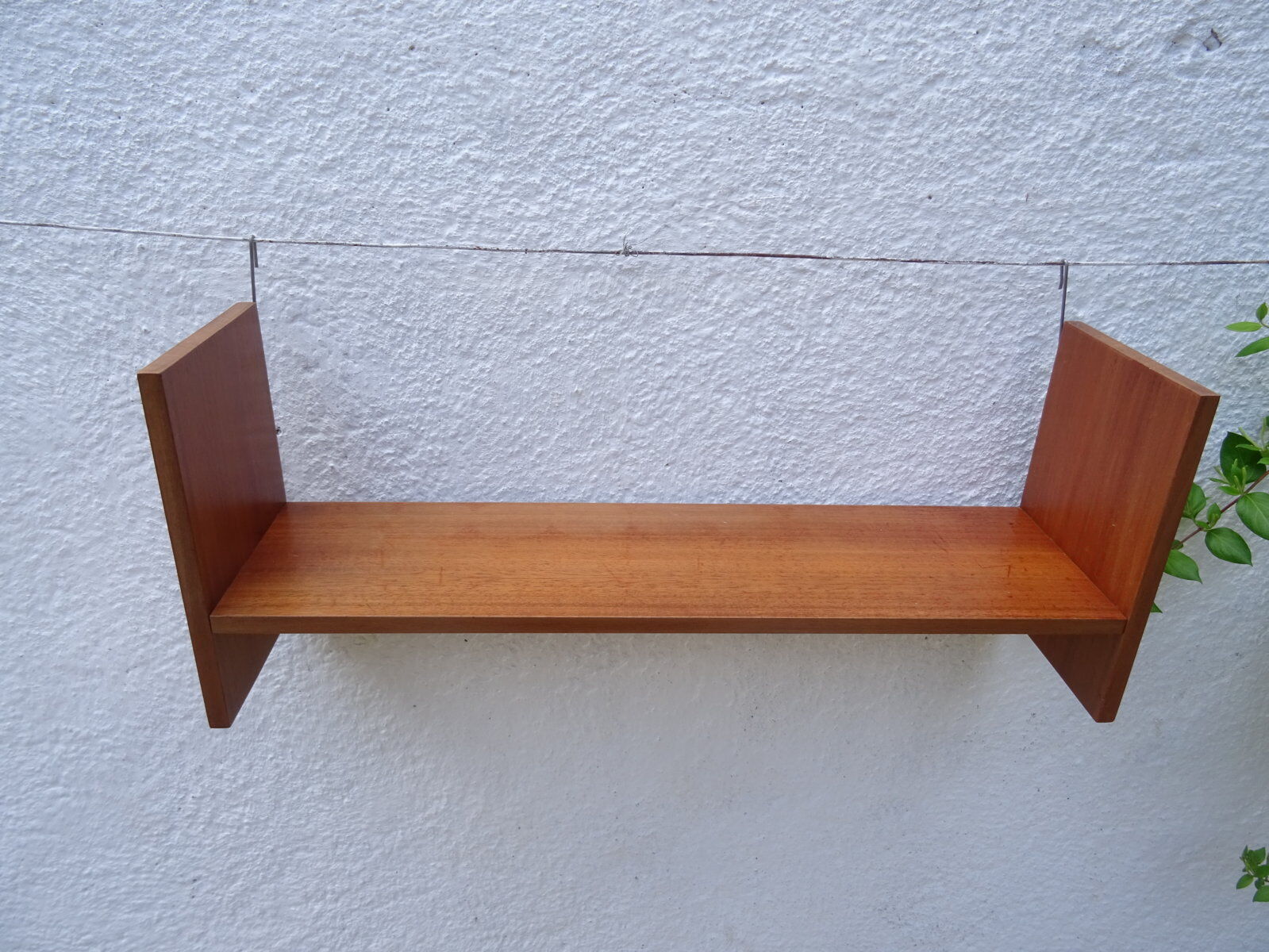 Pair of teak wall shelves