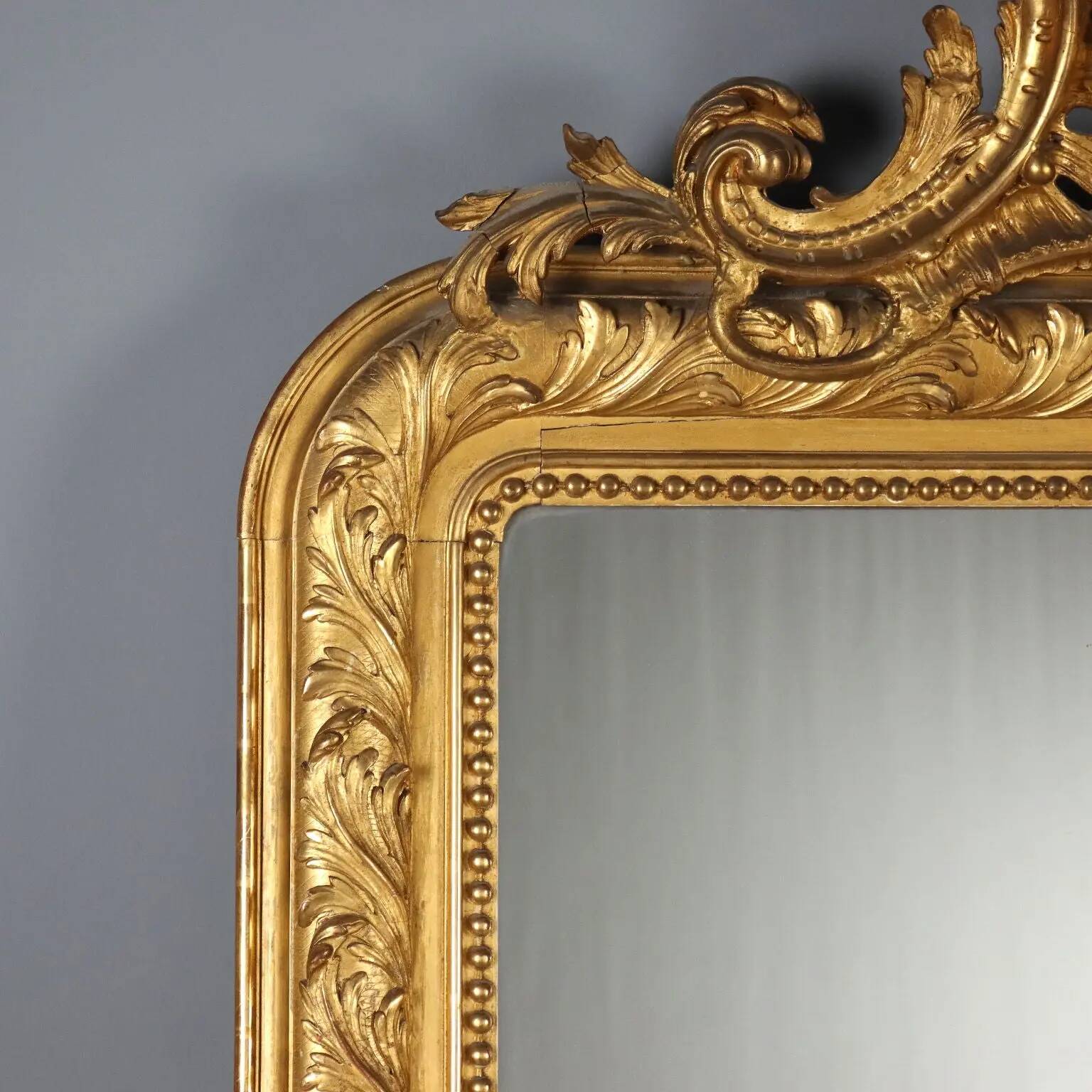 Antique eclectic style mirror in carved and gilded fir, Italy, 19th century.