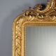 Antique eclectic style mirror in carved and gilded fir, Italy, 19th century.