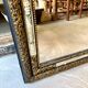 Rectangular Napoleon III mirror in moulded black and gold wood with engraved mirror decoration.