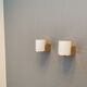 Wall lamps with milky white acrylic plastic shades and solid brass bases