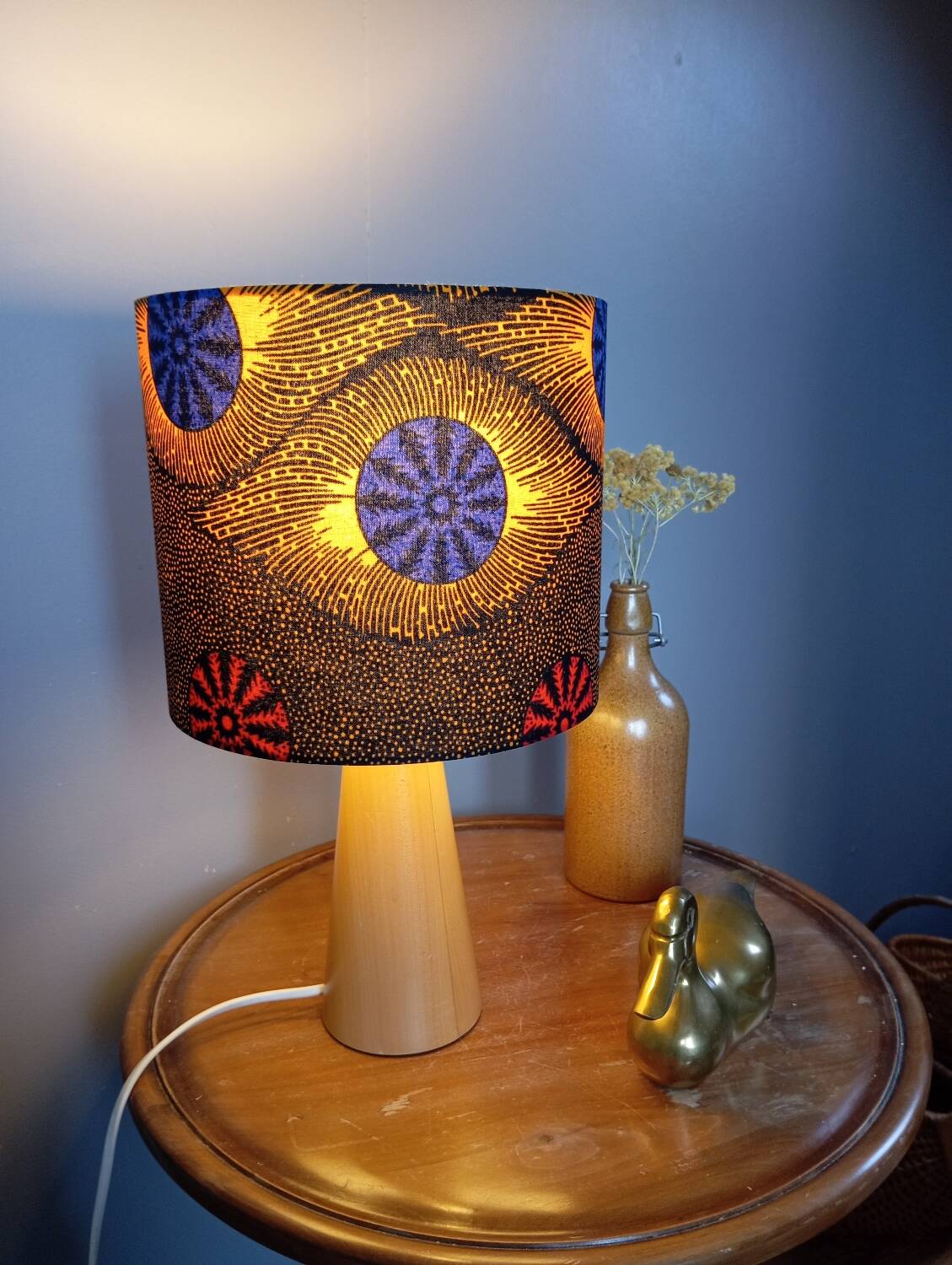 Table lamp in blond wood with handmade wax shade