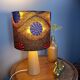Table lamp in blond wood with handmade wax shade