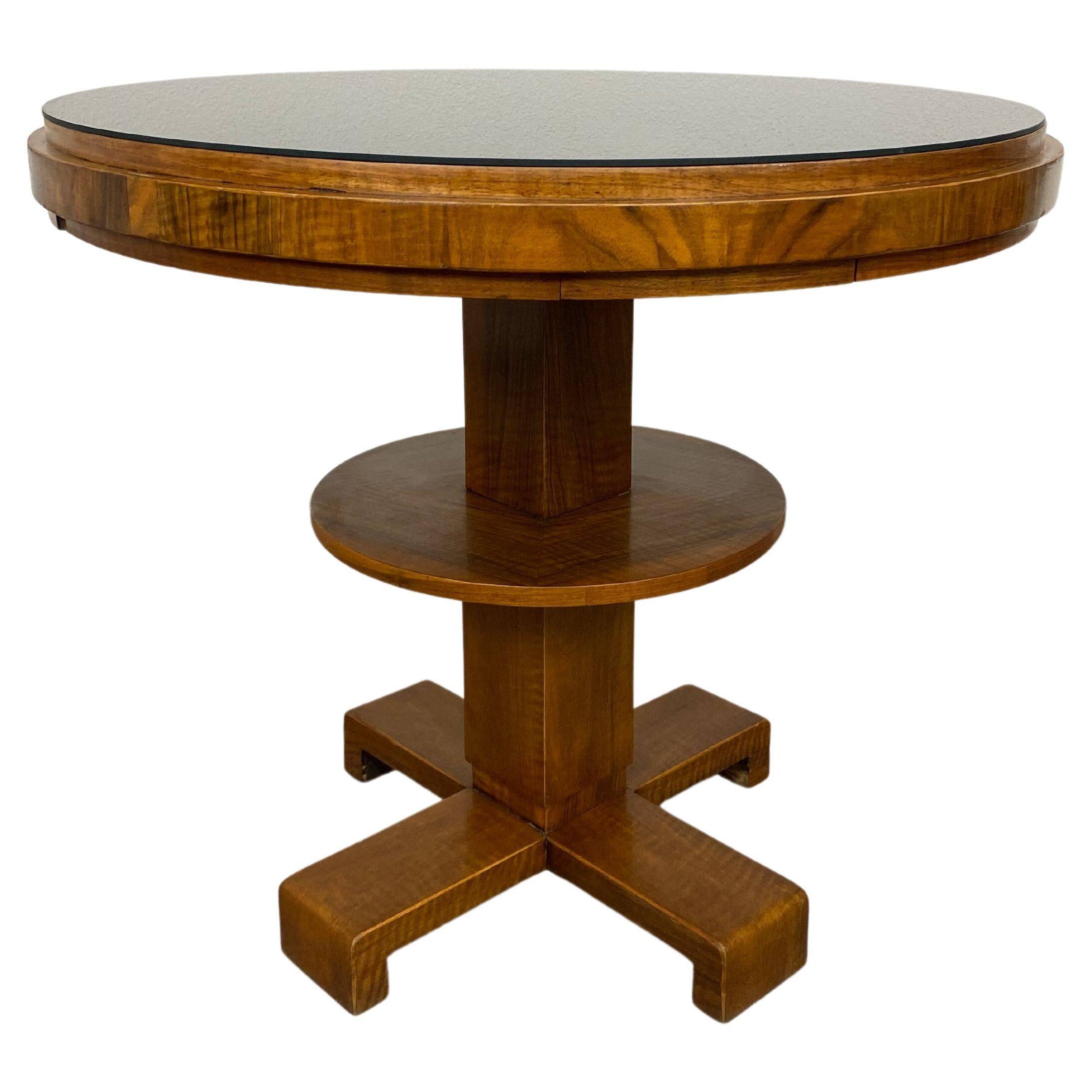 Art Deco game table with a black glass top.