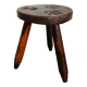 Tabouret tripode en bois sculpté