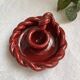 Twisted red earthenware candle holder - in the style of St Clément