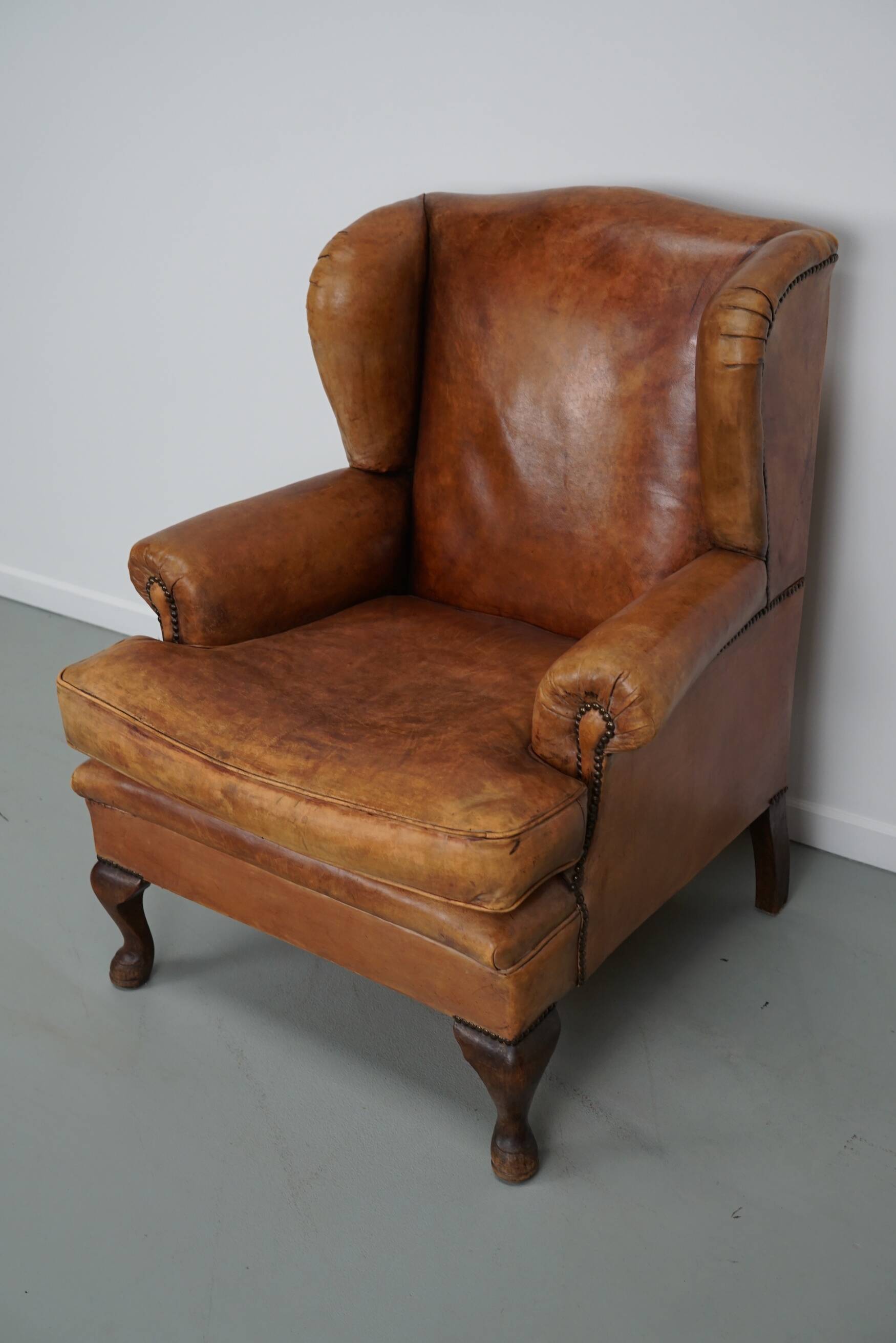 Vintage Dutch cognac coloured leather club chair, with footstool