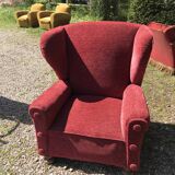Impressive red velvet eared armchair